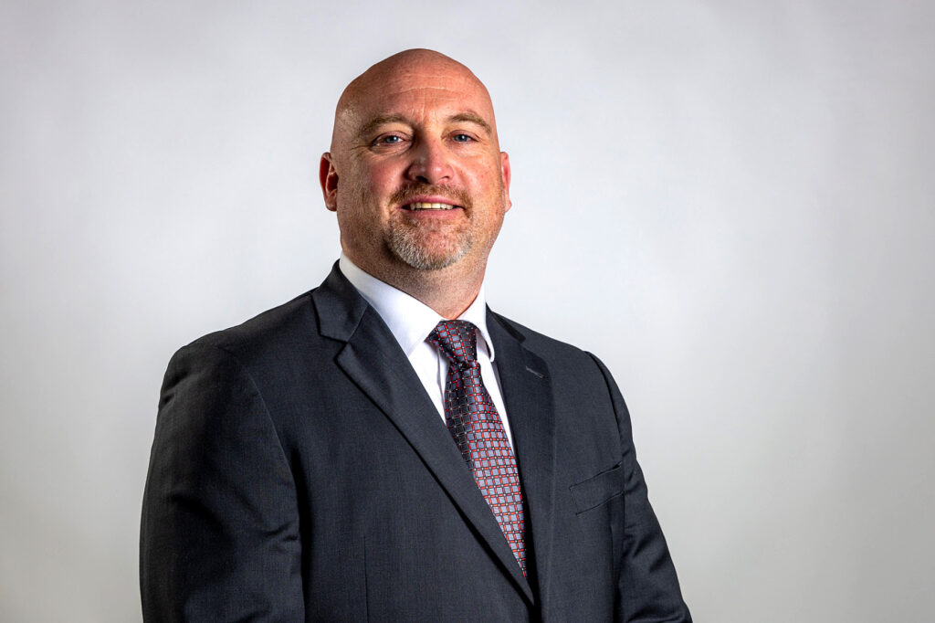 Photo of Athletic Director Cameron "Cam" Olson.